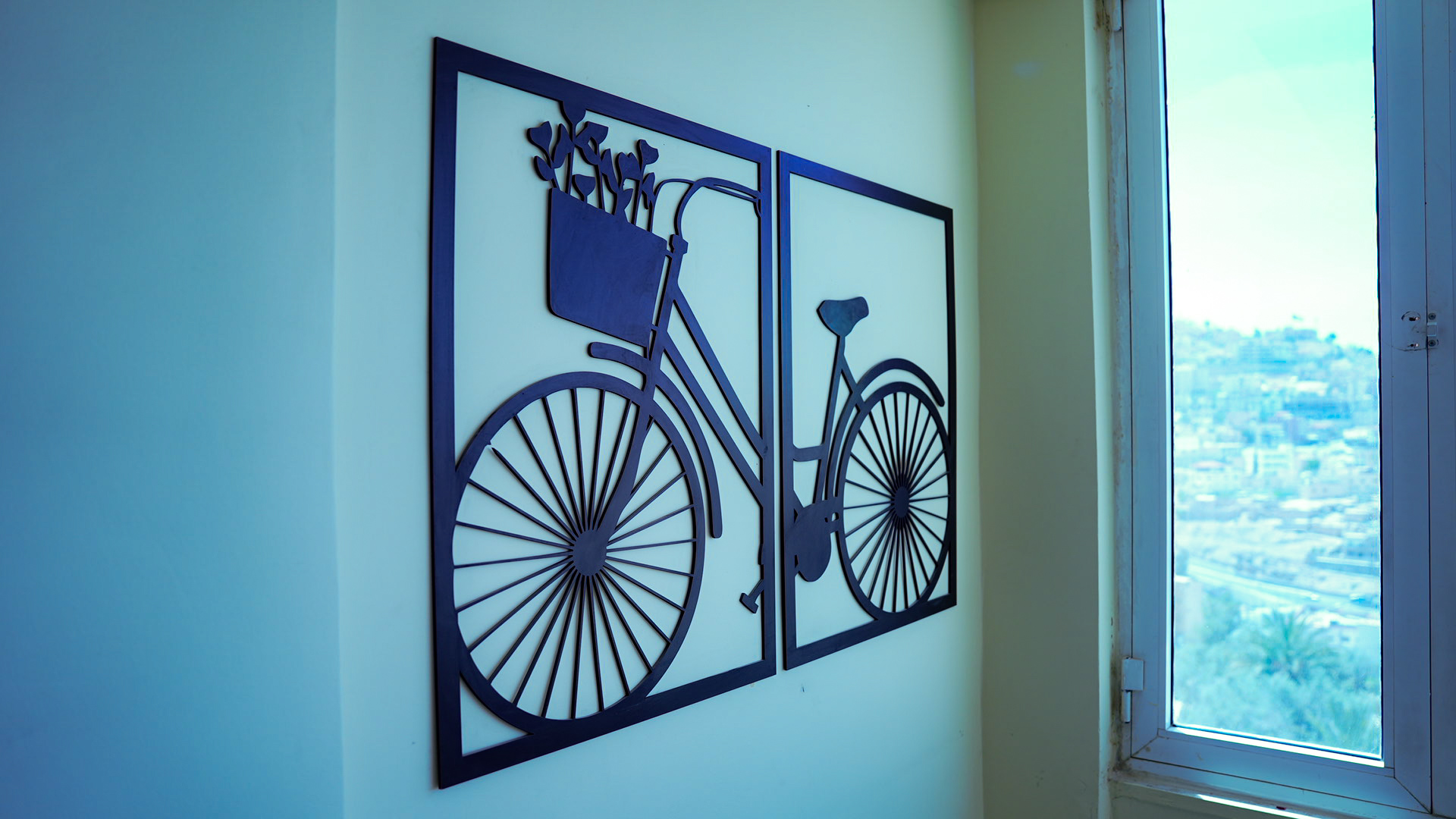 Bicycle wall art with view over Wadi Musa