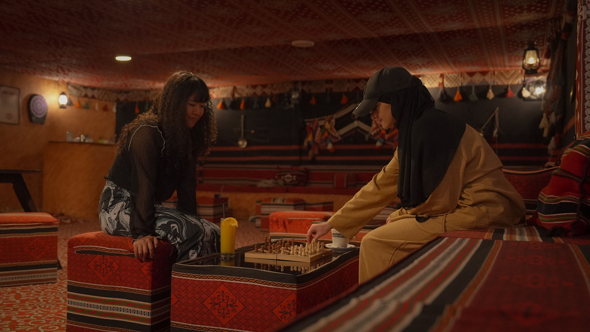 Guests playing chess in the Bedouin-style rooftop lounge