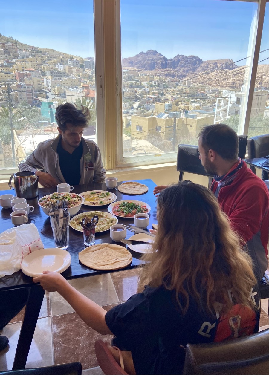 Guests sharing a Jordanian breakfast with a view of Wadi Musa