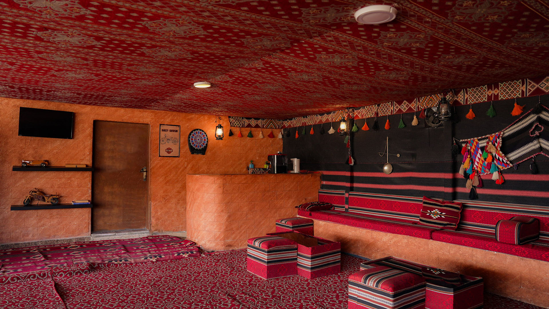 Bedouin-style rooftop lounge with coffee corner and dart board